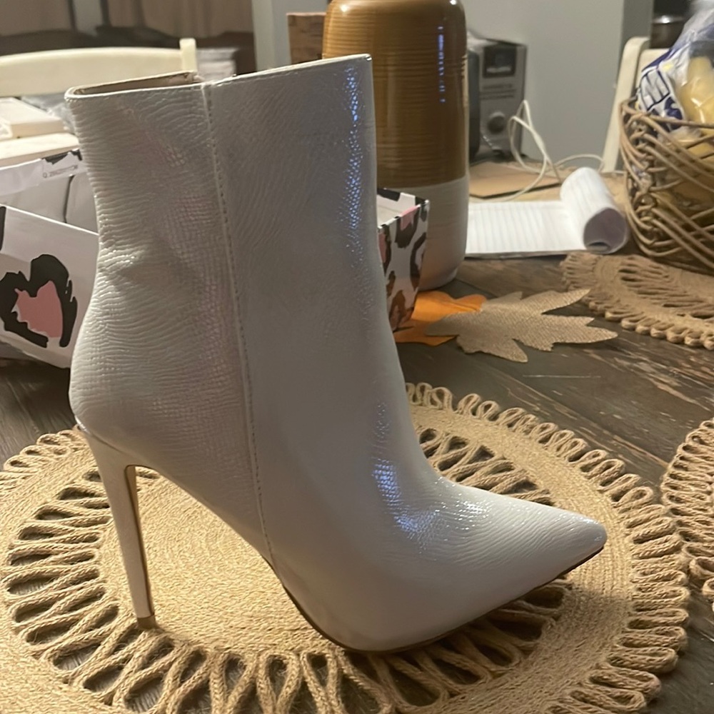 White ankle high heel boots , brand new never worn size 9
